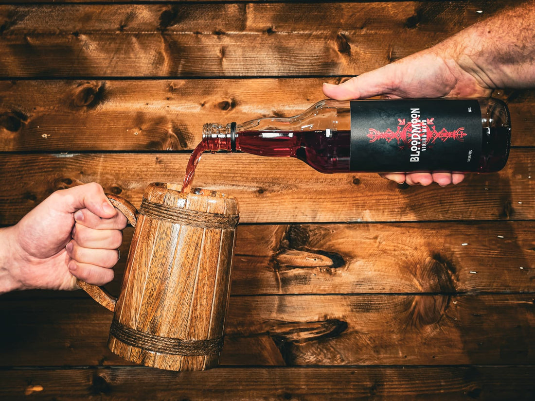 Bloodmoon Viking Mead being poured into a wooden tankard