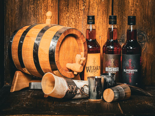 Oak mead barrel with Wizards, Berserker and Bloodmoon mead bottles and drinking horns